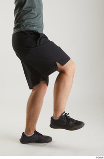Yoshinaga Kuri  1 black shorts black sneakers dressed flexing…